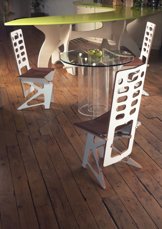 Three Maya chairs around a glass table